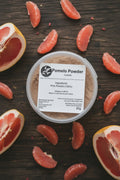 Pomelo Powder container with label on a rustic background